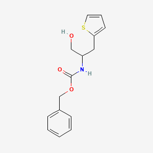 molecular formula C15H17NO3S B13488548 Phenylmethyl [2-hydroxy-1-(2-thienylmethyl)ethyl]carbamate 