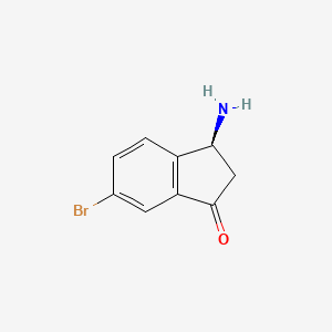 (3S)-3-amino-6-bromo-2,3-dihydro-1H-inden-1-one