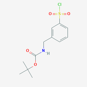 molecular formula C12H16ClNO4S B13498176 tert-butyl N-{[3-(chlorosulfonyl)phenyl]methyl}carbamate 