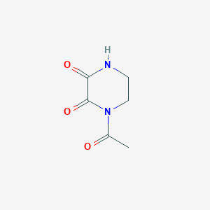 B135017 1-Acetylpiperazine-2,3-dione CAS No. 132269-98-8