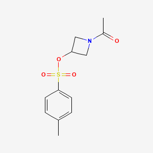 molecular formula C12H15NO4S B13507557 1-Acetylazetidin-3-yl 4-methylbenzene-1-sulfonate 