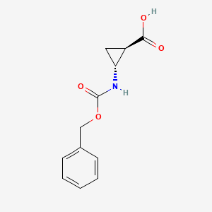 molecular formula C12H13NO4 B13514548 rac-(1R,2R)-2-{[(benzyloxy)carbonyl]amino}cyclopropane-1-carboxylic acid 