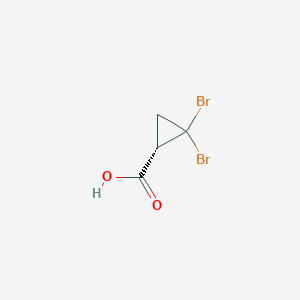 (1S)-2,2-Dibromocyclopropane-1-carboxylic acid