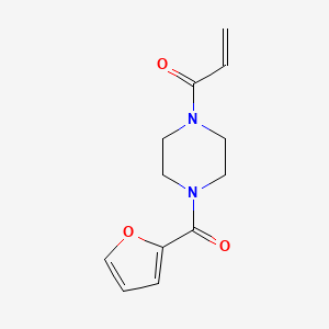 molecular formula C12H14N2O3 B13521559 1-(4-(Furan-2-carbonyl)piperazin-1-yl)prop-2-en-1-one 