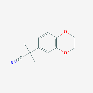 molecular formula C12H13NO2 B13534680 2-(2,3-Dihydrobenzo[b][1,4]dioxin-6-yl)-2-methylpropanenitrile 