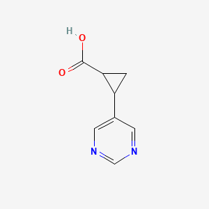 molecular formula C8H8N2O2 B13536038 2-(5-Pyrimidinyl)cyclopropanecarboxylic Acid 