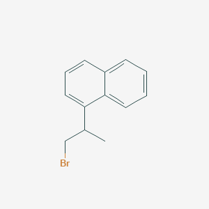 molecular formula C13H13Br B13559178 1-(1-Bromopropan-2-yl)naphthalene 