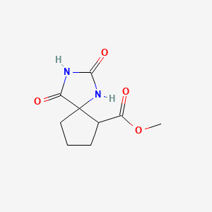 molecular formula C9H12N2O4 B13564022 Methyl 2,4-dioxo-1,3-diazaspiro[4.4]nonane-6-carboxylate 