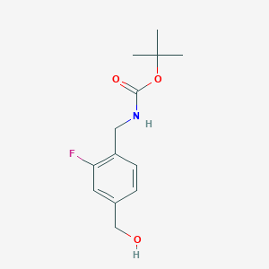 molecular formula C13H18FNO3 B13564383 tert-butyl N-{[2-fluoro-4-(hydroxymethyl)phenyl]methyl}carbamate 