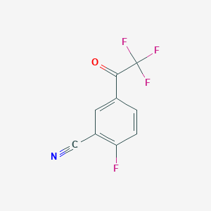 molecular formula C9H3F4NO B13566275 2-Fluoro-5-(trifluoroacetyl)benzonitrile 