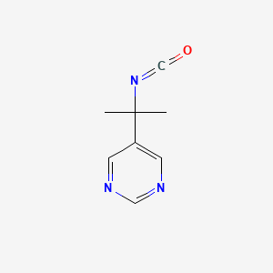 molecular formula C8H9N3O B13579112 2-(5-Pyrimidinyl)-2-propylisocyanate 