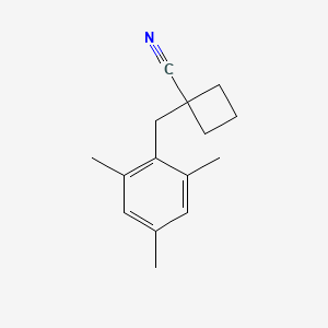 1-(2,4,6-Trimethylbenzyl)cyclobutane-1-carbonitrile