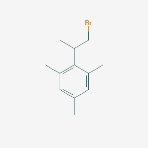 molecular formula C12H17Br B13605345 2-(1-Bromopropan-2-yl)-1,3,5-trimethylbenzene 