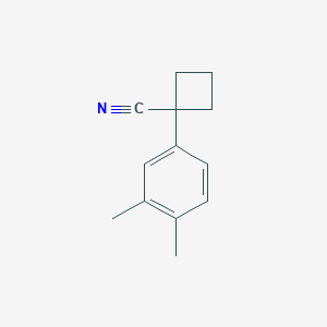 molecular formula C13H15N B13606087 1-(3,4-Dimethylphenyl)cyclobutane-1-carbonitrile 