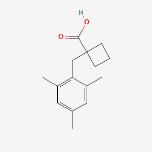 1-(2,4,6-Trimethylbenzyl)cyclobutane-1-carboxylic acid