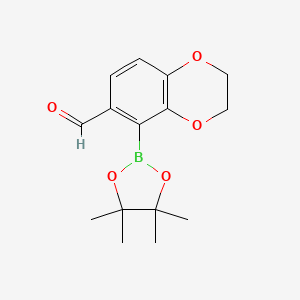 molecular formula C15H19BO5 B13642578 5-(4,4,5,5-Tetramethyl-1,3,2-dioxaborolan-2-yl)-2,3-dihydro-1,4-benzodioxine-6-carbaldehyde 