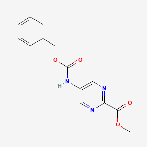 molecular formula C14H13N3O4 B13659273 Methyl 5-(((benzyloxy)carbonyl)amino)pyrimidine-2-carboxylate 