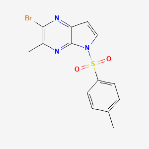 molecular formula C14H12BrN3O2S B13665053 2-Bromo-3-methyl-5-tosyl-5H-pyrrolo[2,3-b]pyrazine 