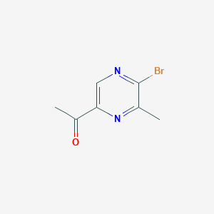 molecular formula C7H7BrN2O B13677902 1-(5-Bromo-6-methylpyrazin-2-yl)ethan-1-one 