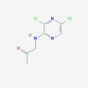 molecular formula C7H7Cl2N3O B13684027 1-[(3,5-Dichloropyrazin-2-yl)amino]-2-propanone 