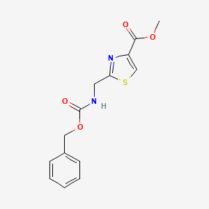 molecular formula C14H14N2O4S B13687579 Methyl 2-[(Cbz-amino)methyl]thiazole-4-carboxylate 