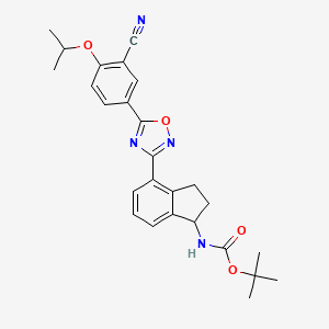 molecular formula C26H28N4O4 B13693078 (S)-5-[3-[1-(Boc-amino)-4-indanyl]-1,2,4-oxadiazol-5-yl]-2-isopropoxybenzonitrile 