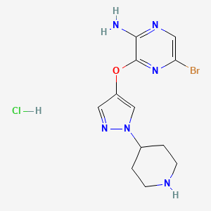 molecular formula C12H16BrClN6O B13697236 5-Bromo-3-[[1-(4-piperidyl)-4-pyrazolyl]oxy]pyrazin-2-amine Hydrochloride 