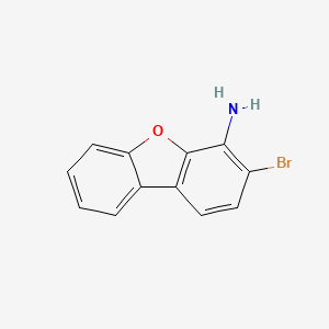 molecular formula C12H8BrNO B13702082 3-Bromodibenzo[b,d]furan-4-amine 