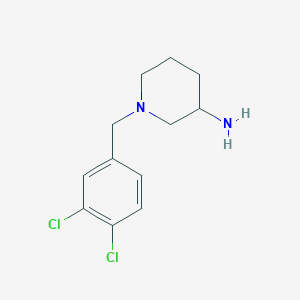 molecular formula C12H16Cl2N2 B1370506 1-[(3,4-Dichlorophenyl)methyl]piperidin-3-amine 