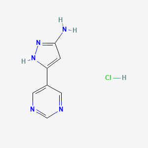 molecular formula C7H8ClN5 B13706945 3-Amino-5-(5-pyrimidinyl)pyrazole Hydrochloride 