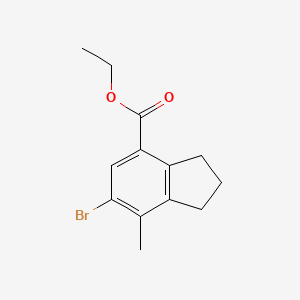 molecular formula C13H15BrO2 B13707048 Ethyl 6-Bromo-7-methylindane-4-carboxylate 