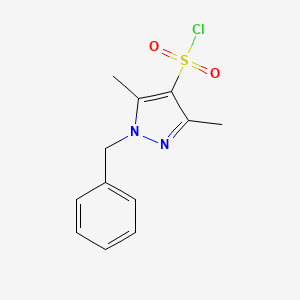 molecular formula C12H13ClN2O2S B1371103 1-benzyl-3,5-dimethyl-1H-pyrazole-4-sulfonyl chloride CAS No. 1156916-20-9