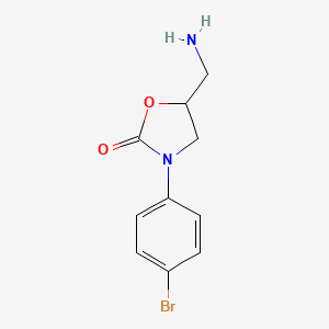 molecular formula C10H11BrN2O2 B1371414 5-(Aminomethyl)-3-(4-bromophenyl)oxazolidin-2-one 