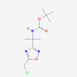 molecular formula C11H18ClN3O3 B1372074 叔丁基 N-{2-[5-(氯甲基)-1,2,4-恶二唑-3-基]丙-2-基}氨基甲酸酯 CAS No. 1210153-70-0