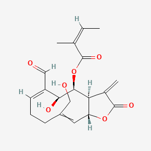 molecular formula C20H24O7 B13728996 [(3aS,4S,5S,6E,11aR)-6-formyl-5-hydroxy-10-(hydroxymethyl)-3-methylidene-2-oxo-3a,4,5,8,9,11a-hexahydrocyclodeca[b]furan-4-yl] (Z)-2-methylbut-2-enoate 