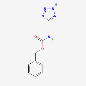 molecular formula C12H15N5O2 B1373333 benzyl N-[2-(1H-1,2,3,4-tetrazol-5-yl)propan-2-yl]carbamate CAS No. 455875-25-9