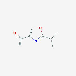 molecular formula C7H9NO2 B1373793 2-Isopropyl-1,3-oxazole-4-carbaldehyde CAS No. 202817-15-0