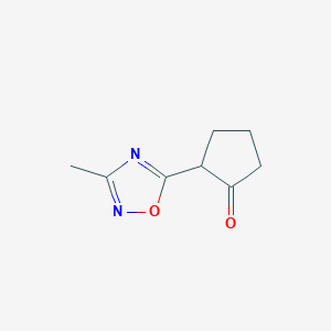 molecular formula C8H10N2O2 B1374030 2-(3-Methyl-1,2,4-oxadiazol-5-yl)cyclopentan-1-one CAS No. 1343762-75-3