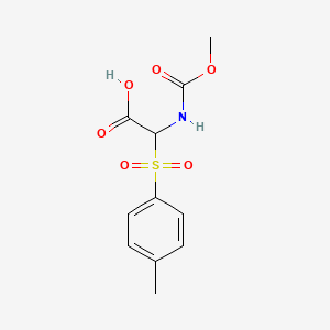 molecular formula C11H13NO6S B13742933 ((Methoxycarbonyl)amino)((4-methylphenyl)sulphonyl)acetic acid CAS No. 41141-95-1