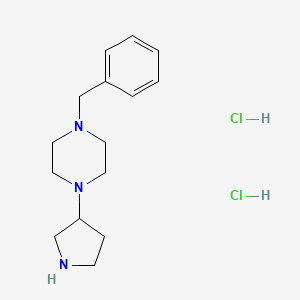 molecular formula C15H25Cl2N3 B1374873 1-Benzyl-4-(3-pyrrolidinyl)piperazine dihydrochloride CAS No. 1220038-32-3