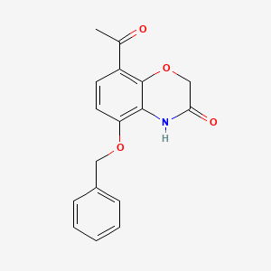 molecular formula C17H15NO4 B1374942 8-乙酰基-5-(苄氧基)-2H-苯并[b][1,4]恶嗪-3(4H)-酮 CAS No. 1035229-32-3