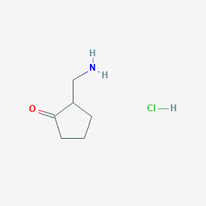 molecular formula C6H12ClNO B1375296 2-(Aminomethyl)cyclopentan-1-one hydrochloride CAS No. 1360547-45-0