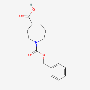 molecular formula C15H19NO4 B1375403 1-[(苄氧羰基)]氮杂环庚烷-4-羧酸 CAS No. 1195256-01-9