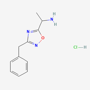 molecular formula C11H14ClN3O B1375842 1-(3-苄基-1,2,4-恶二唑-5-基)乙-1-胺盐酸盐 CAS No. 1384428-19-6