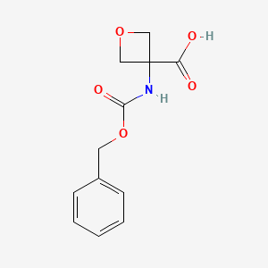 molecular formula C12H13NO5 B1375998 3-(((Benzyloxy)carbonyl)amino)oxetane-3-carboxylic acid CAS No. 1379811-81-0