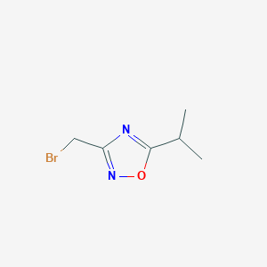 molecular formula C6H9BrN2O B1376136 3-(Bromomethyl)-5-isopropyl-1,2,4-oxadiazole CAS No. 1312700-11-0