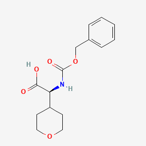molecular formula C15H19NO5 B1376282 (S)-2-(((Benzyloxy)carbonyl)amino)-2-(tetrahydro-2H-pyran-4-yl)acetic acid CAS No. 1098184-12-3