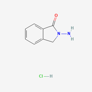 molecular formula C8H9ClN2O B1376530 2-amino-2,3-dihydro-1H-isoindol-1-one hydrochloride CAS No. 23990-36-5
