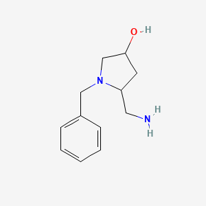 molecular formula C12H18N2O B1377133 5-(Aminomethyl)-1-benzylpyrrolidin-3-ol CAS No. 1423023-91-9