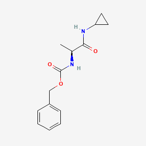 B1377921 Benzyl N-[(1S)-1-(cyclopropylcarbamoyl)ethyl]carbamate CAS No. 1314806-92-2